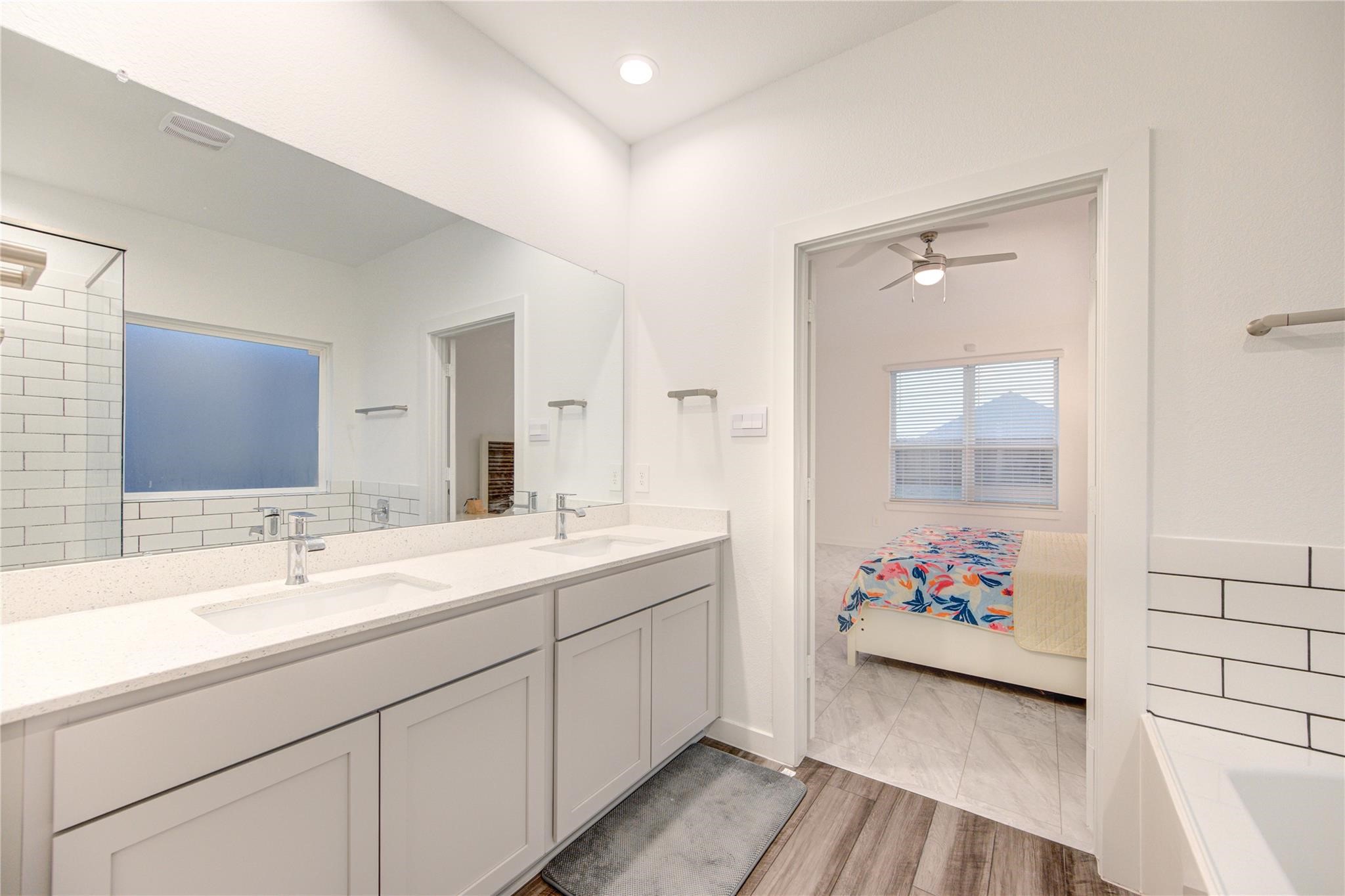 22515 Modica Rift Lane Katy, TX 77449 - Photo 29 of 34 a bathroom with a sink mirror and vanity