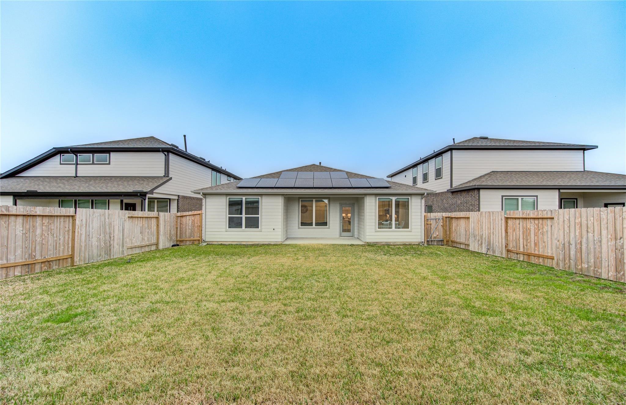 22515 Modica Rift Lane Katy, TX 77449 - Photo 32 of 34 a front view of a house with a garden