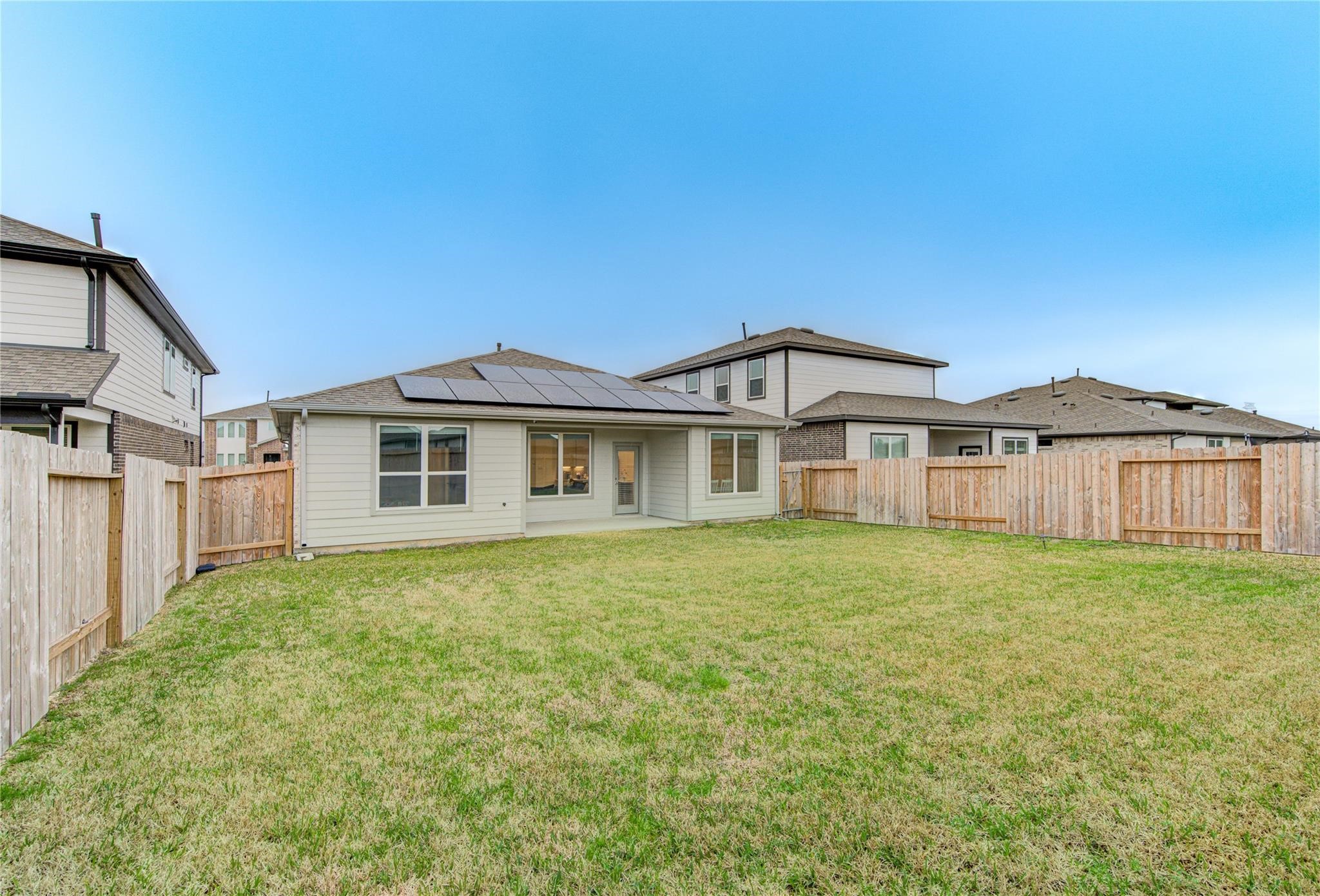 22515 Modica Rift Lane Katy, TX 77449 - Photo 33 of 34 a big white house with a big yard and large trees