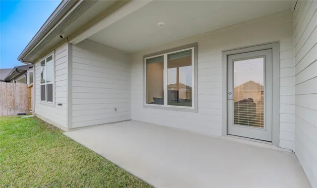 a view of an empty room with windows