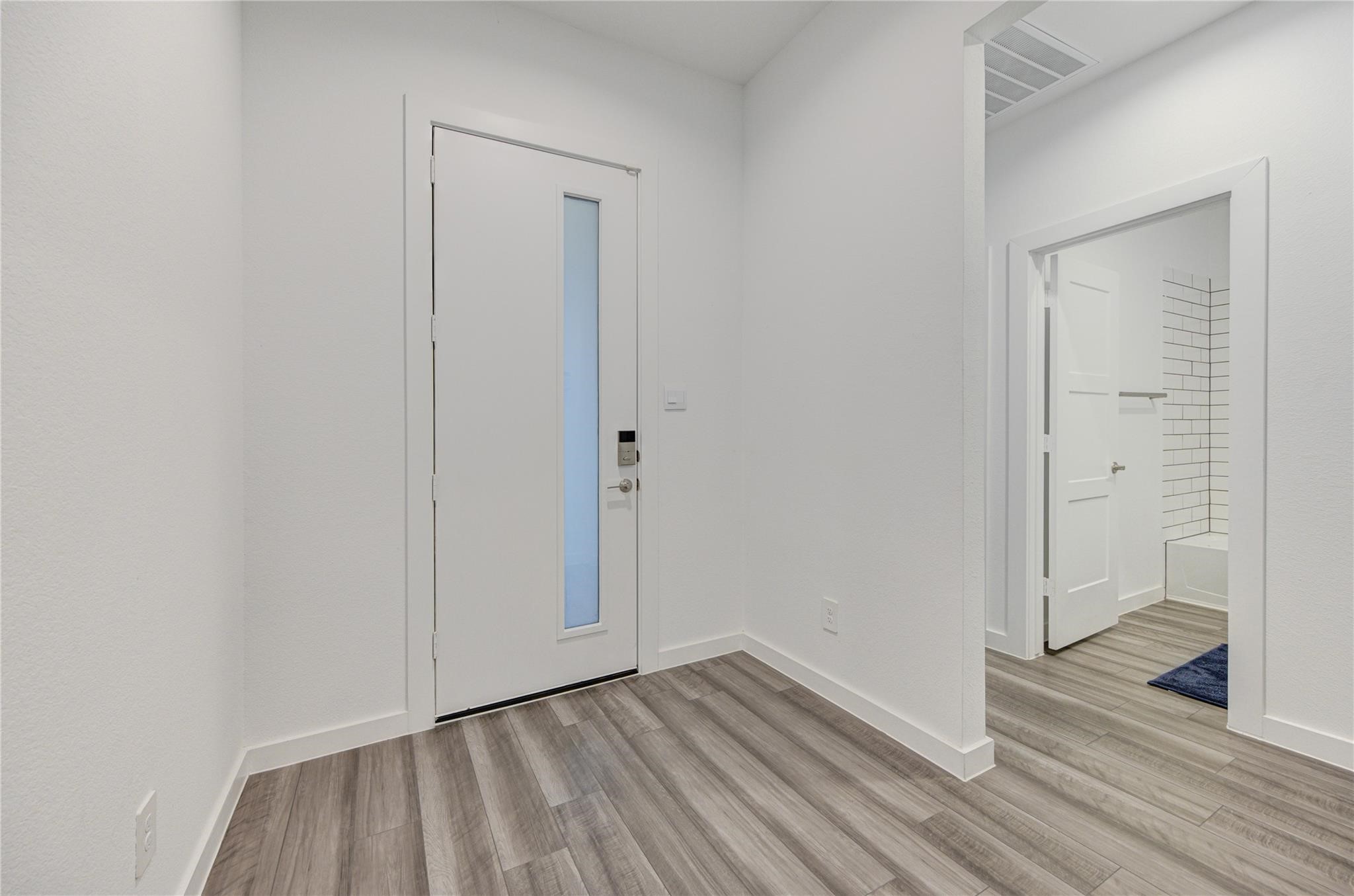 22515 Modica Rift Lane Katy, TX 77449 - Photo 6 of 34 a view of an empty room and wooden floor