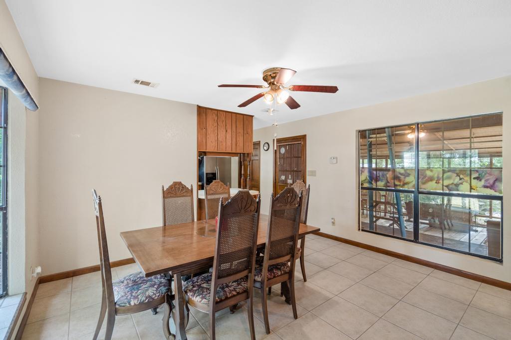 710 Ridge Lake Road Crestview, FL 32536 - Photo 25 of 43 a view of a dining room with furniture window and outside view
