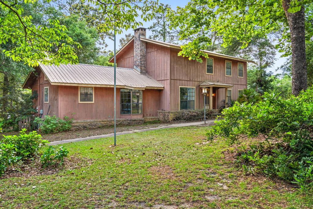 710 Ridge Lake Road Crestview, FL 32536 - Photo 43 of 43 a house that has a tree in front of it