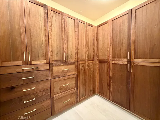 a spacious bathroom with a tub sink shower and mirror