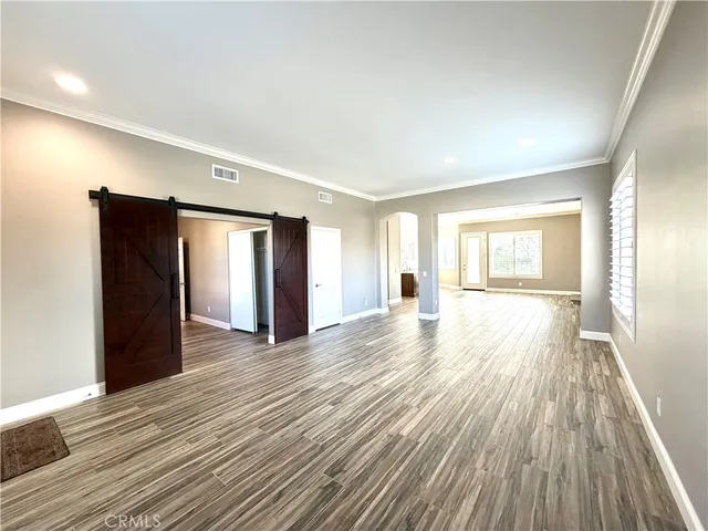 a view of a livingroom with wooden floor