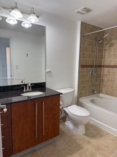 7350 Southwest 89th Street, Unit 907S Miami, FL 33156 - Photo 11 of 25 a bathroom with a sink a toilet a mirror and bathtub
