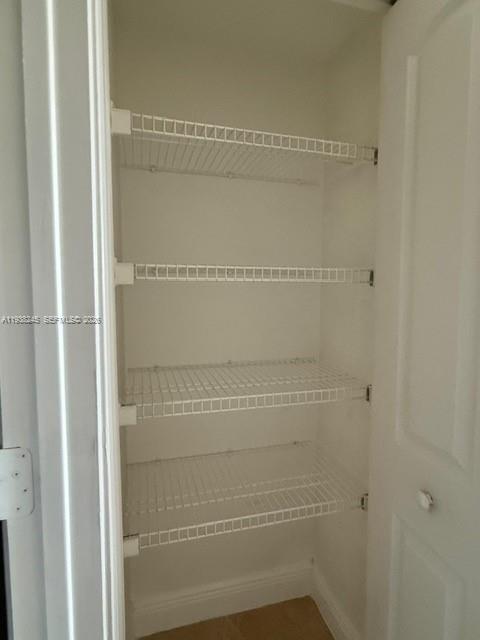 7350 Southwest 89th Street, Unit 907S Miami, FL 33156 - Photo 14 of 25 a bathroom with a glass shower door