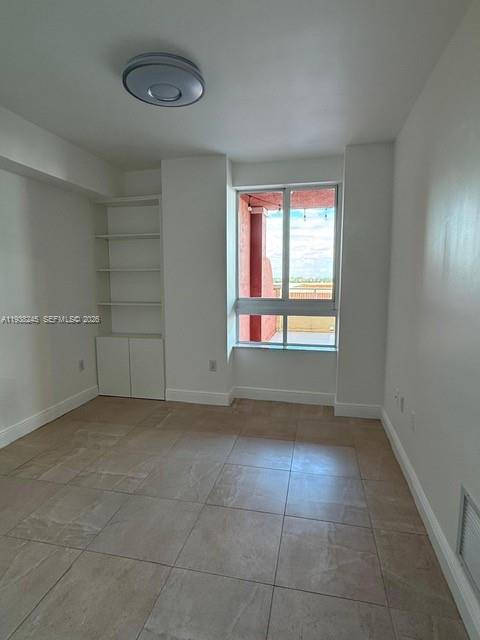 7350 Southwest 89th Street, Unit 907S Miami, FL 33156 - Photo 15 of 25 a view of an empty room with a window