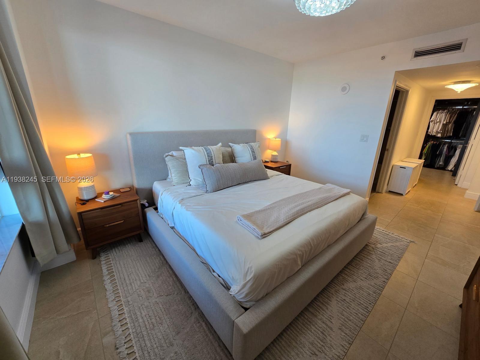 7350 Southwest 89th Street, Unit 907S Miami, FL 33156 - Photo 15 of 19 a bed room with a bed and a couch