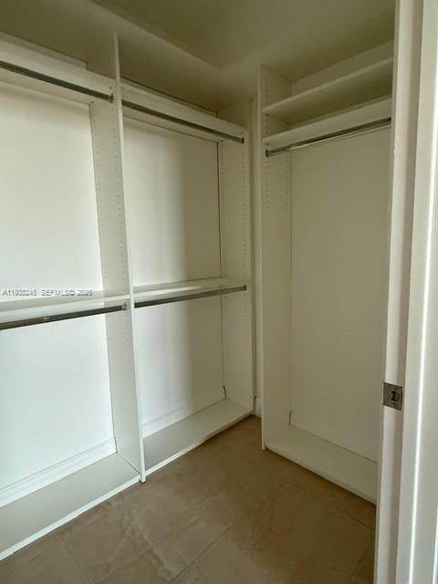 7350 Southwest 89th Street, Unit 907S Miami, FL 33156 - Photo 17 of 25 a view of an empty walk in closet