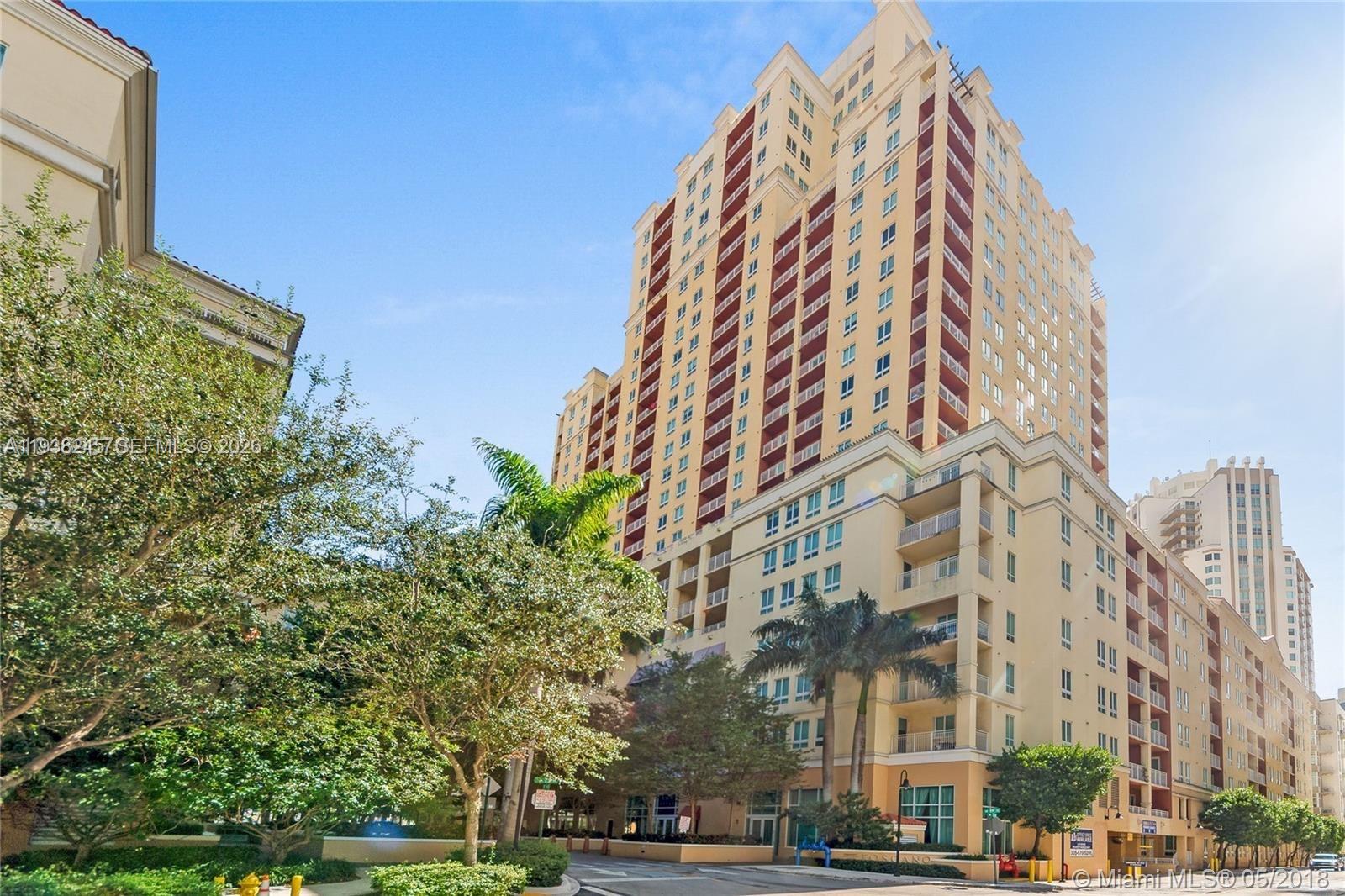 7350 Southwest 89th Street, Unit 907S Miami, FL 33156 - Photo 2 of 19 a view of a tall building next to a road