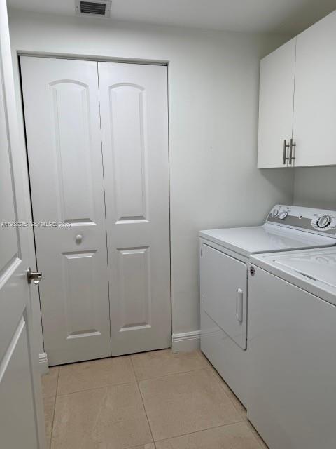 7350 Southwest 89th Street, Unit 907S Miami, FL 33156 - Photo 25 of 25 a utility room with cabinets washer and dryer