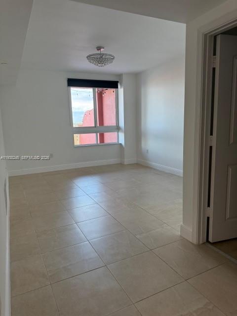 7350 Southwest 89th Street, Unit 907S Miami, FL 33156 - Photo 9 of 25 a view of an empty room with a window
