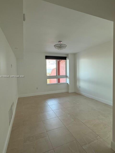 7350 Southwest 89th Street, Unit 907S Miami, FL 33156 - Photo 10 of 25 a view of an empty room with a window