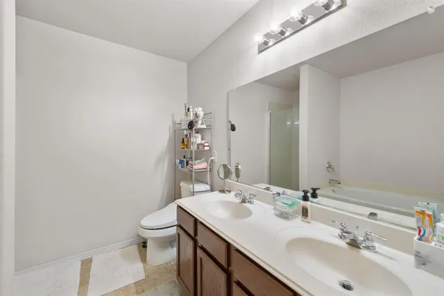 a bathroom with a sink and a toilet