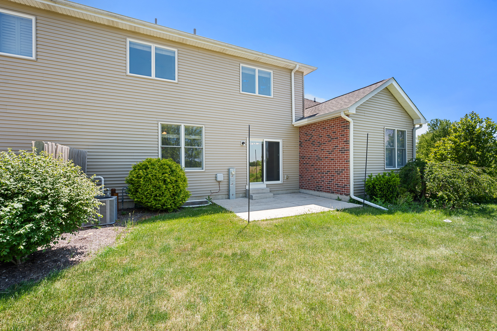 3705 Green Tree Lane DeKalb, IL 60115 - Photo 28 of 31 a view of a house with a yard and plants