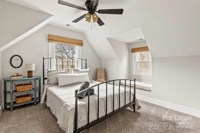 a kitchen with granite countertop white cabinets and appliances