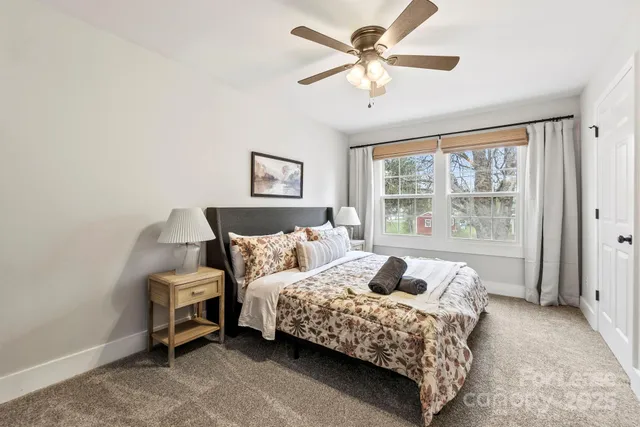 a kitchen with kitchen island granite countertop a stove a sink and a refrigerator