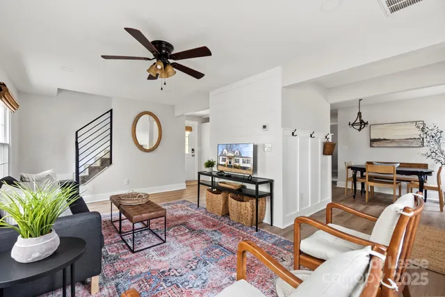 a work room with furniture and a clock