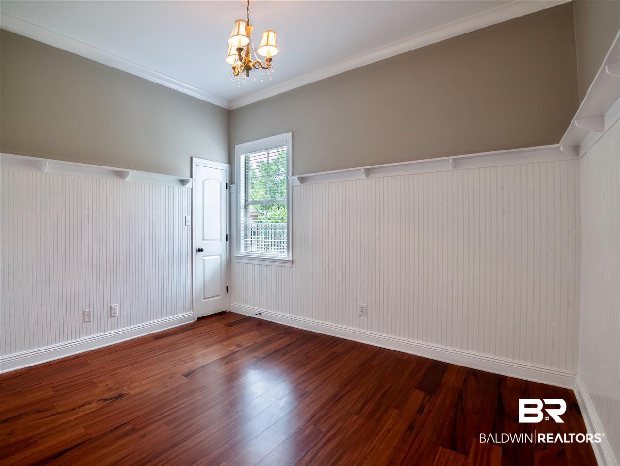 379 Lambton Street Fairhope, AL 36532 - Photo 12 of 25 walk in closet, wood floors and wainscotting