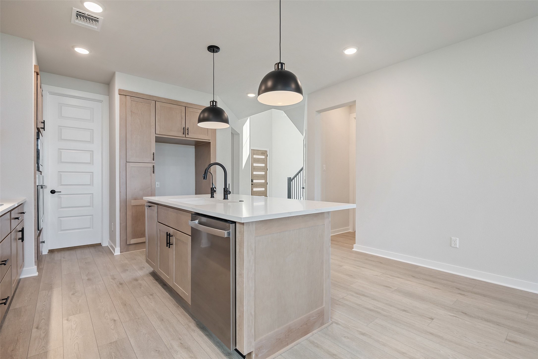 228 Brandywine Road Hutto, TX 78634 - Photo 11 of 40 a kitchen with a sink stainless steel appliances and cabinets