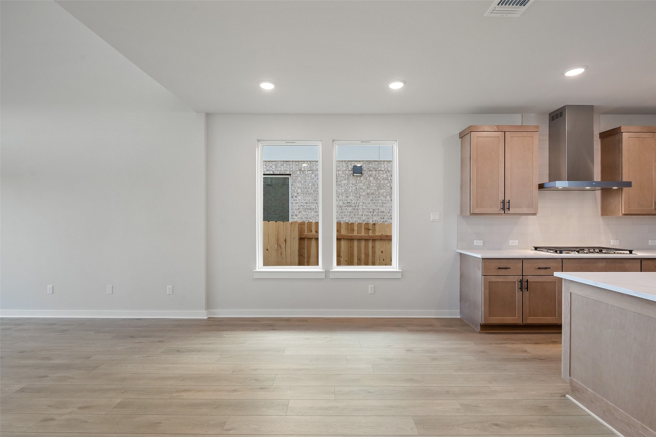 228 Brandywine Road Hutto, TX 78634 - Photo 16 of 40 a kitchen with stainless steel appliances granite countertop a stove and a sink