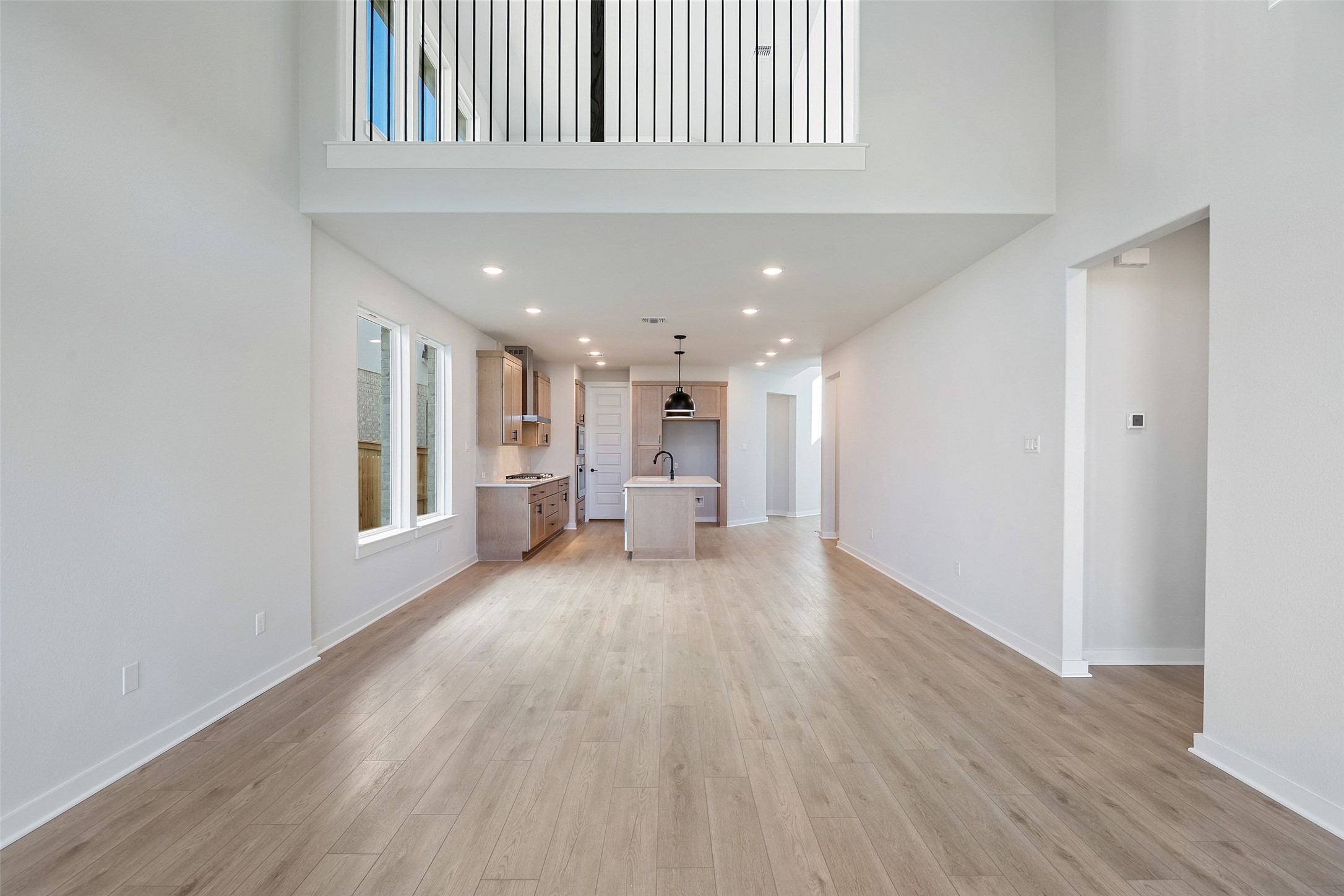 228 Brandywine Road Hutto, TX 78634 - Photo 21 of 40 a view of a house and hallway with wooden floor