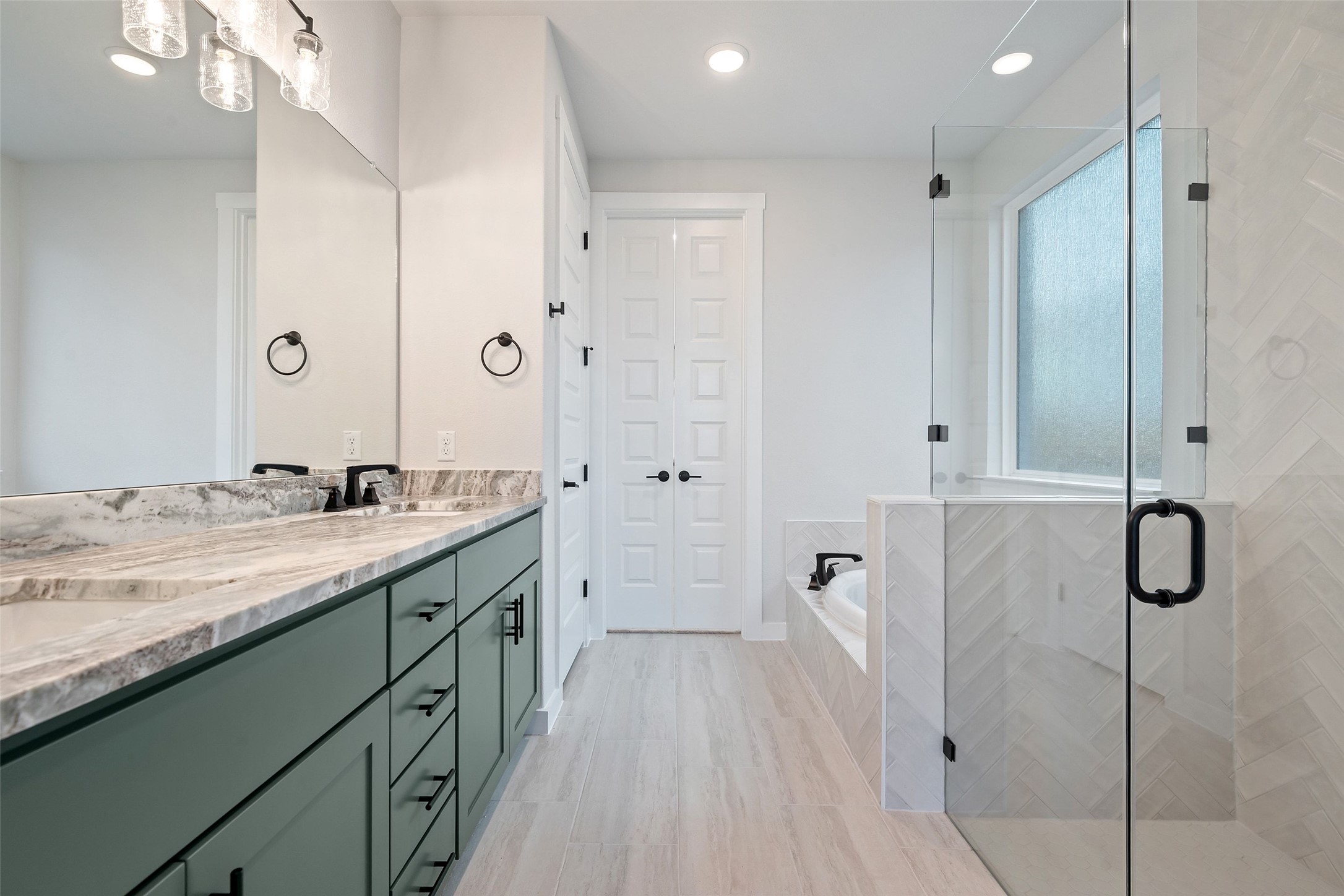 228 Brandywine Road Hutto, TX 78634 - Photo 26 of 40 a spacious bathroom with a granite countertop sink a toilet a mirror and shower