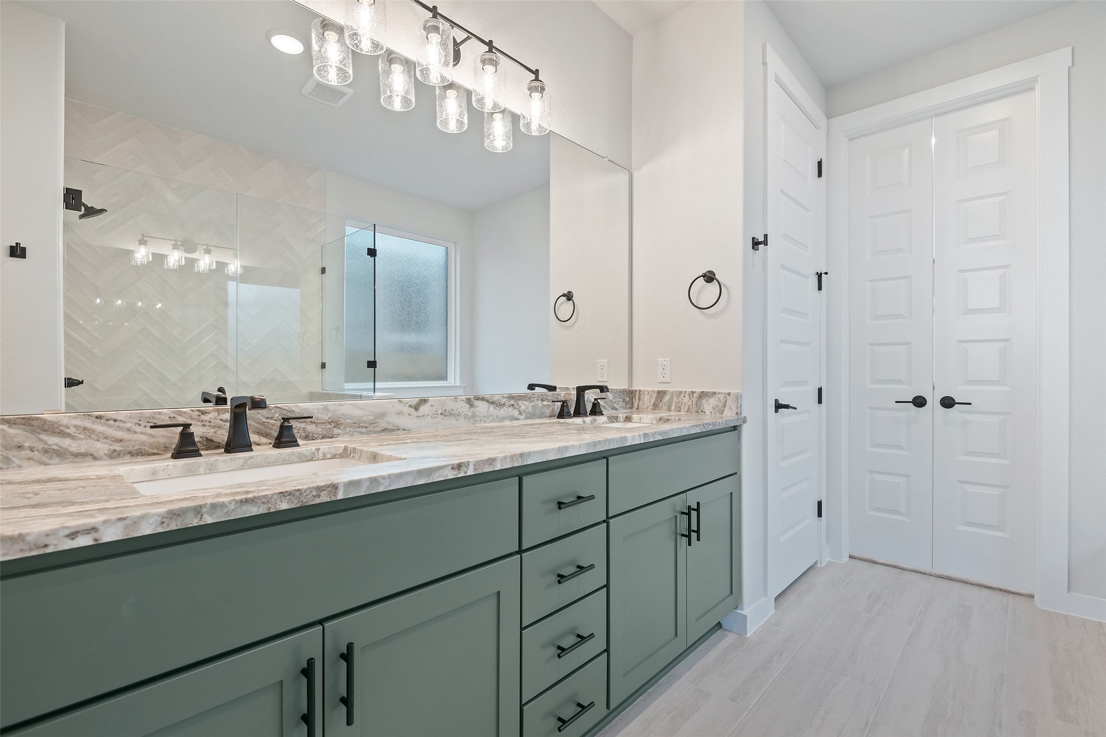 228 Brandywine Road Hutto, TX 78634 - Photo 27 of 40 a bathroom with a granite countertop sink mirror and a