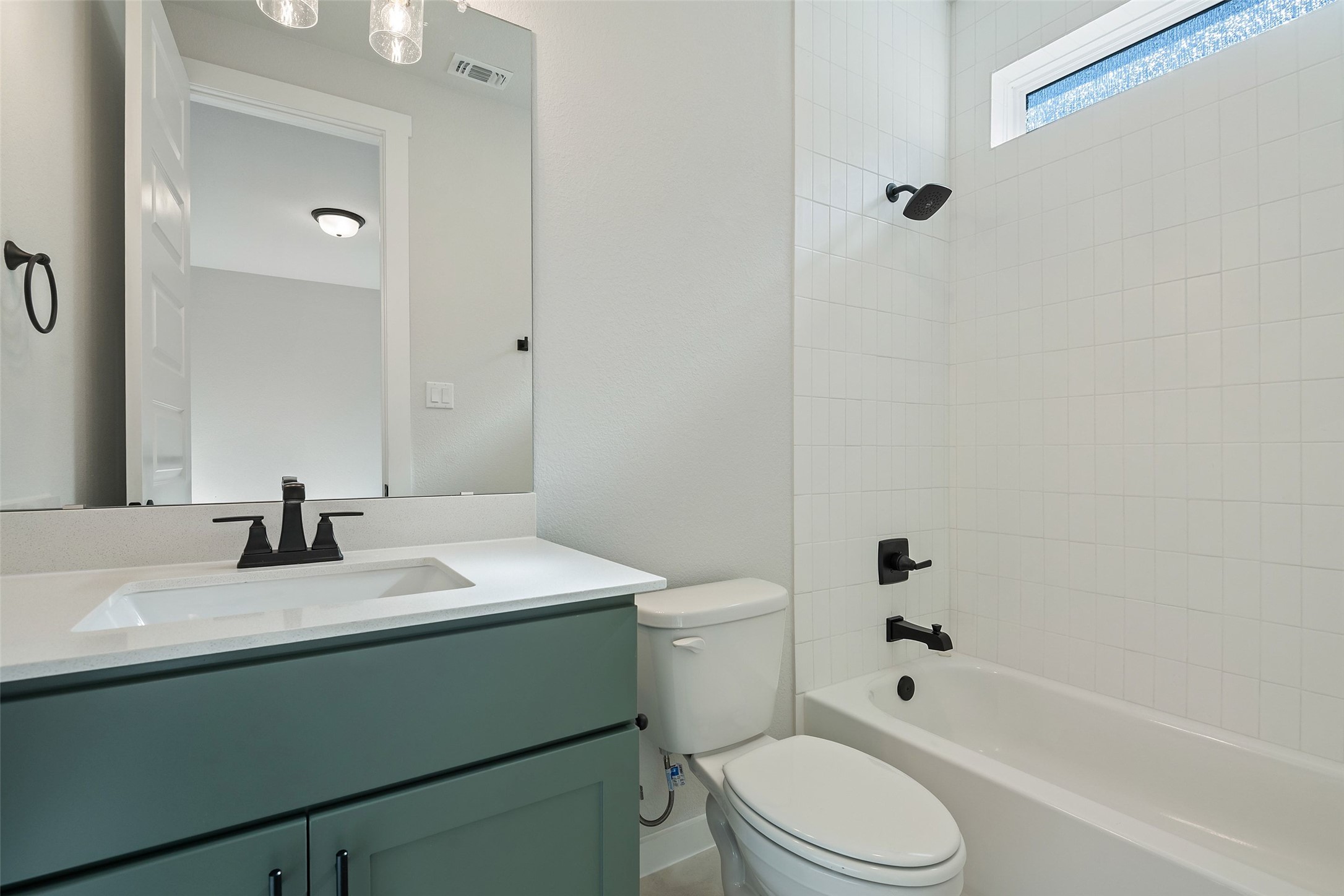 228 Brandywine Road Hutto, TX 78634 - Photo 34 of 40 a bathroom with a sink toilet and shower