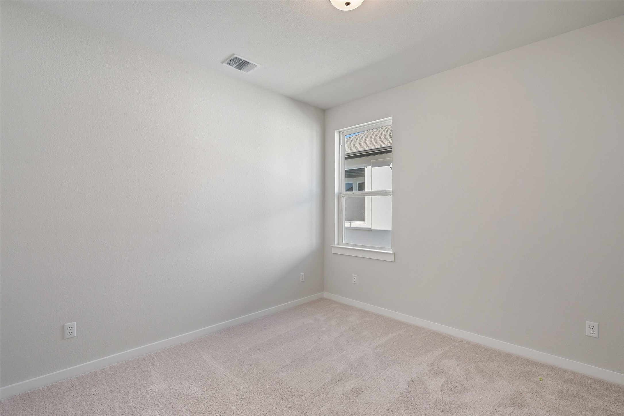 228 Brandywine Road Hutto, TX 78634 - Photo 5 of 40 a view of an empty room with a window