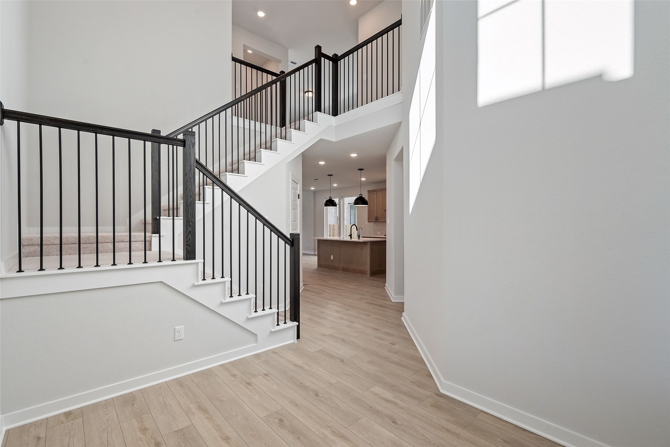 228 Brandywine Road Hutto, TX 78634 - Photo 7 of 40 a view of a hallway with wooden floor and entryway