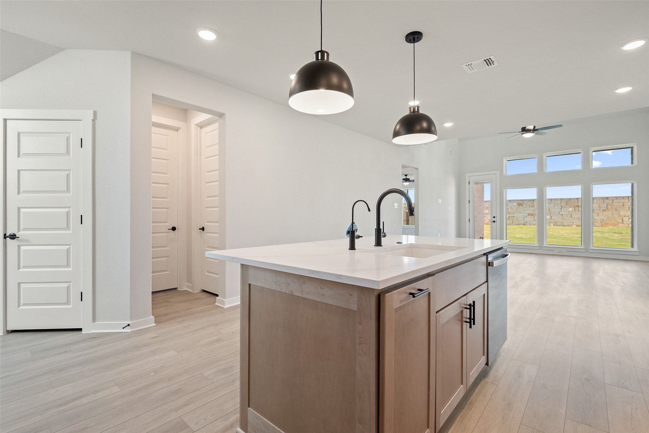 228 Brandywine Road Hutto, TX 78634 - Photo 10 of 40 a kitchen with a sink and a chandelier