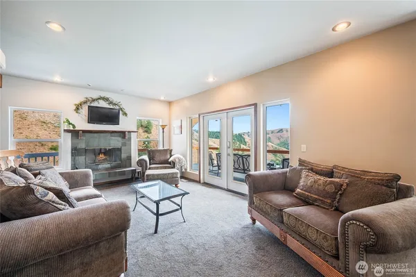 a work room with furniture and a flat screen tv