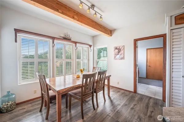 a kitchen with a table and chairs in it