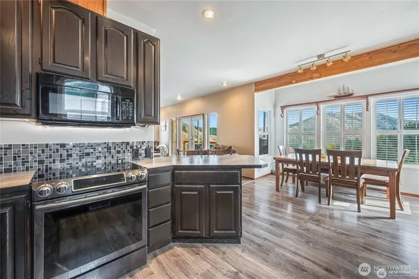 a view of room with window and furniture