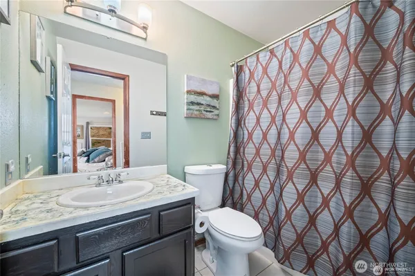 a bedroom with a large bed and a large window