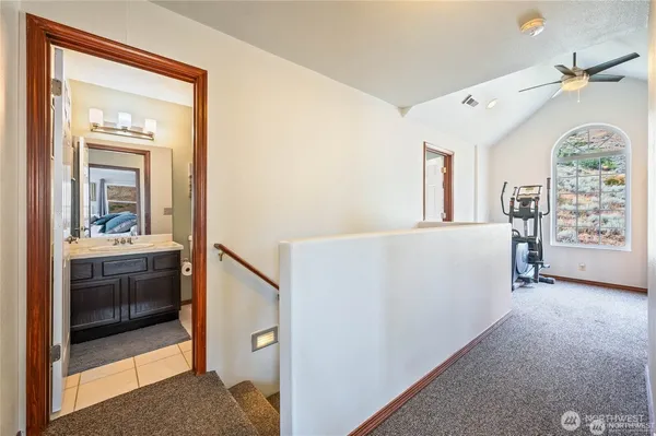 a bedroom with a bed next to a window