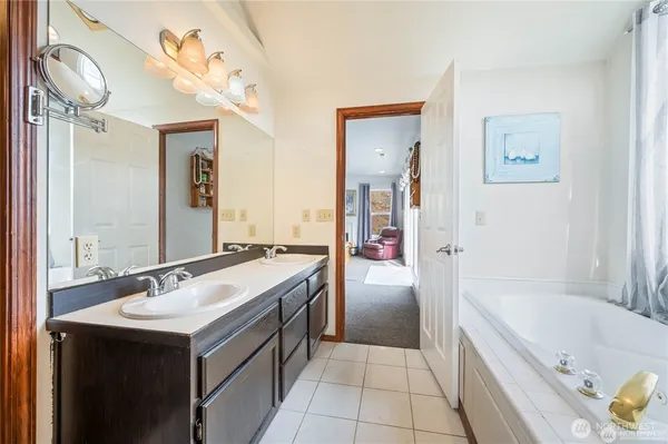 a view of room with workspace and windows