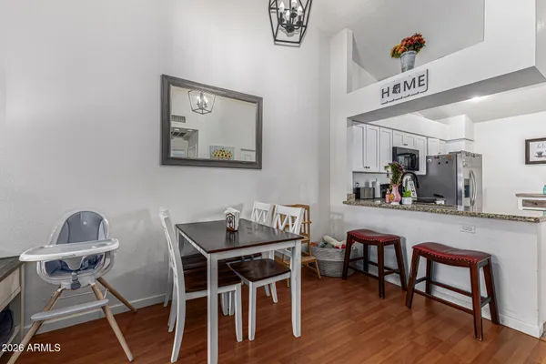 a view of a livingroom with furniture and wooden floor