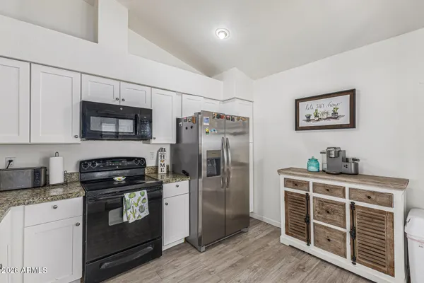 a bedroom with a bed and glass door