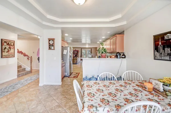 a bed room with a bed and a refrigerator