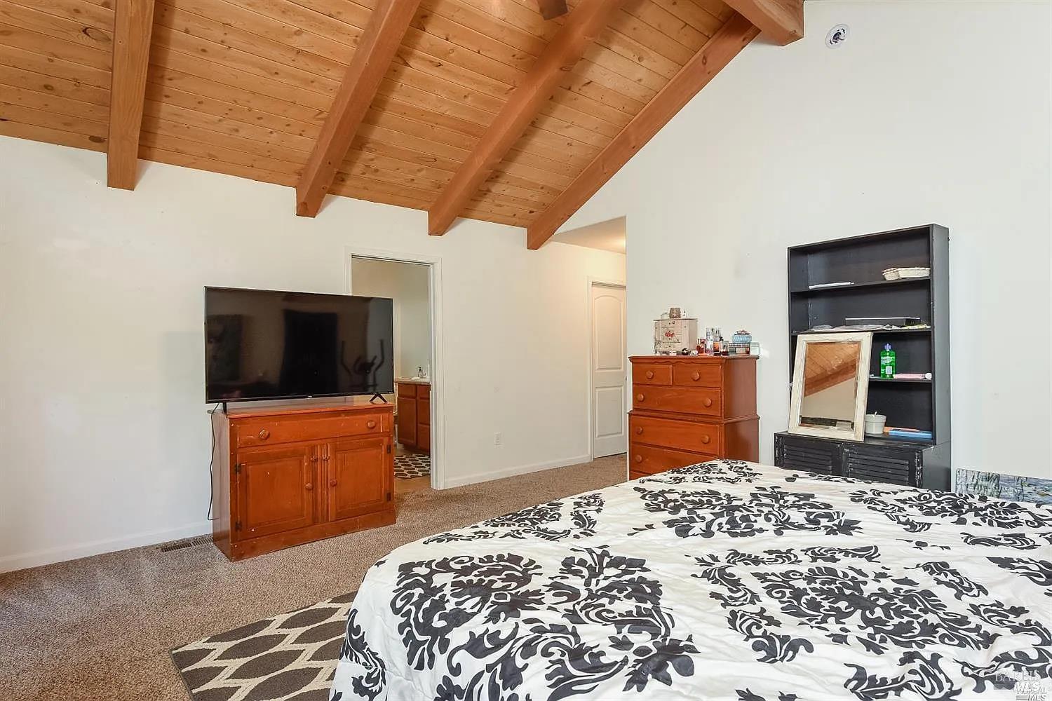 1648 Ronne Drive Santa Rosa, CA 95404 - Photo 12 of 26 a bedroom with a bed and a television in it