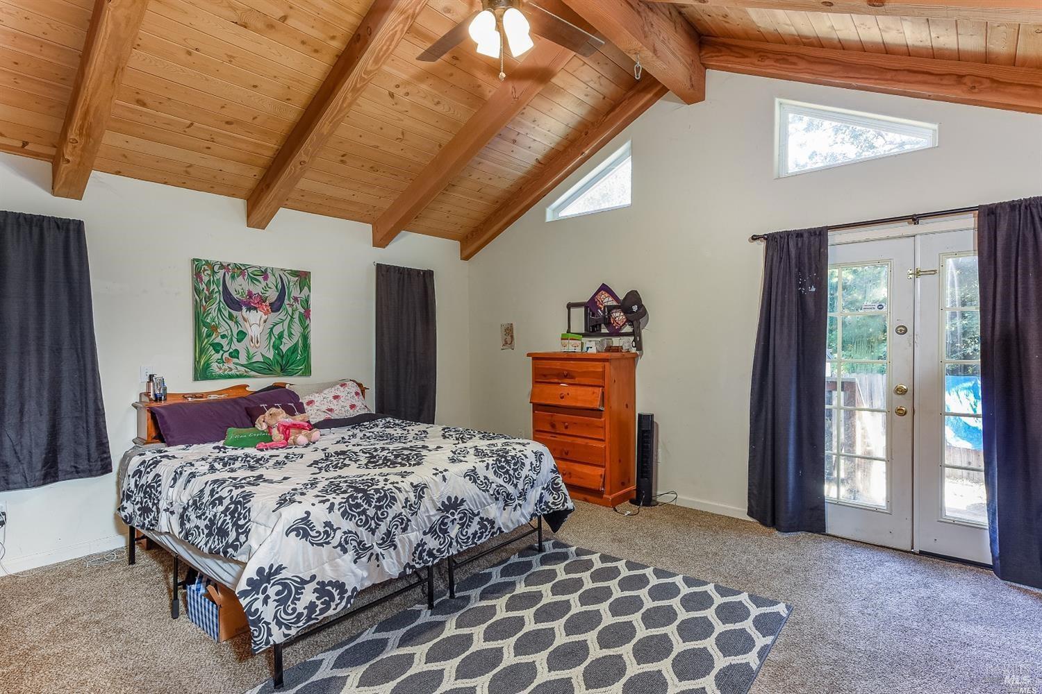 1648 Ronne Drive Santa Rosa, CA 95404 - Photo 13 of 26 a bedroom with a bed and a painting on the wall