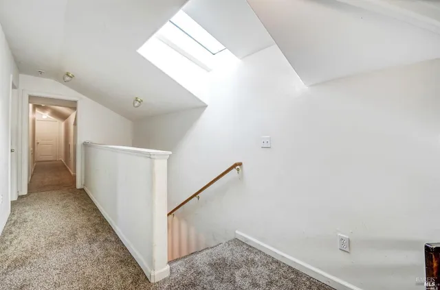 a view of a hallway view with staircase