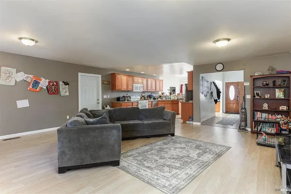 a living room with furniture and a rug