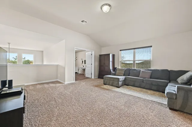 a living room with furniture and a couch