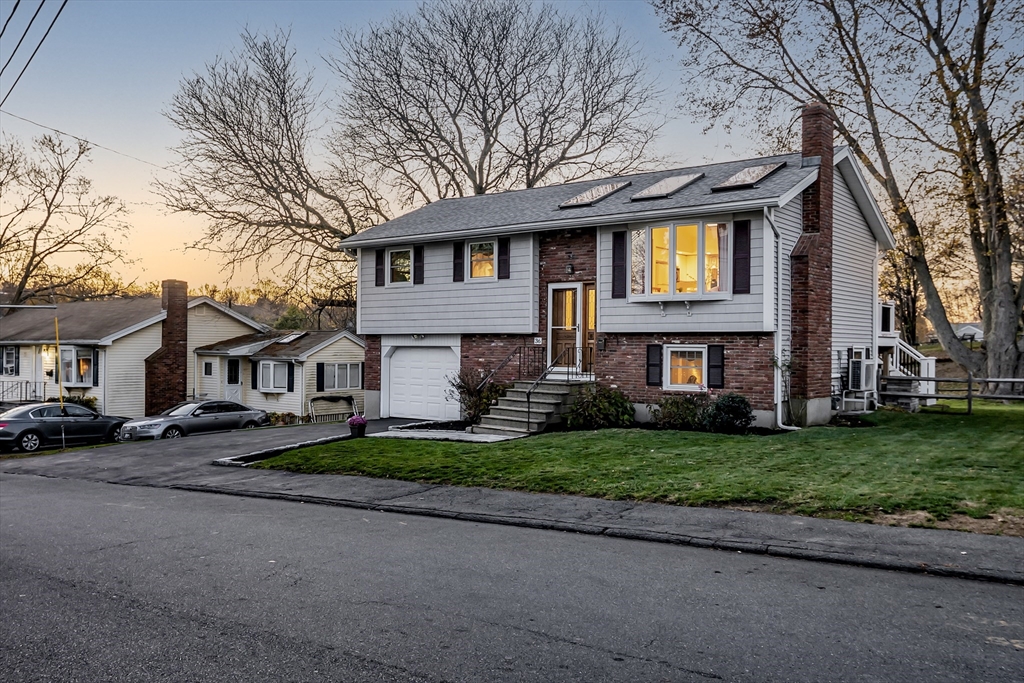 36 Summit Street Salem, MA 01970 - Photo 31 of 42 a front view of a house with a garden