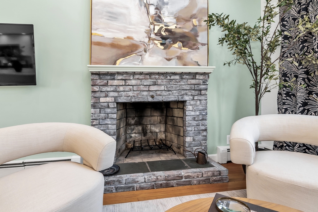 36 Summit Street Salem, MA 01970 - Photo 4 of 42 a living room with furniture and a fireplace