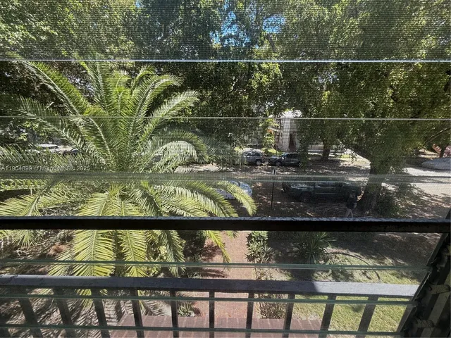 a front view of a house with a yard covered with green space